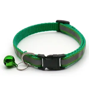 Detail view of the green reflective pet collar featuring a durable black buckle and shiny green bell.