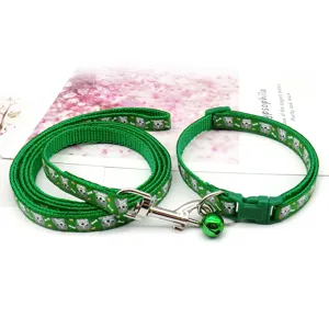 Green pet leash and collar set with cute animal prints, small bell, and durable buckle.