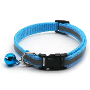 Blue reflective pet collar detail featuring adjustable plastic buckle and cute bell.