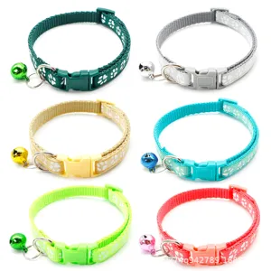 Adjustable pet collar with cute paw print pattern and metal bell, multi-color options.
