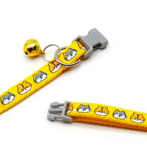 Yellow cartoon dog print pet collar with quick release buckle and gold bell for cats.