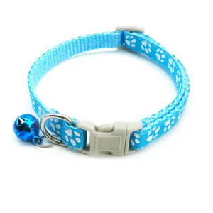 Blue nylon cat collar featuring cute white paw print patterns, a safe buckle, and a bell.