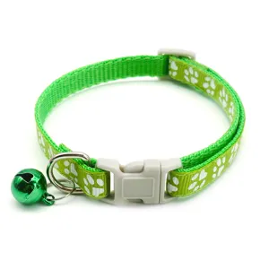 Green nylon cat collar with white paw prints, quick release buckle and cute sweet bell