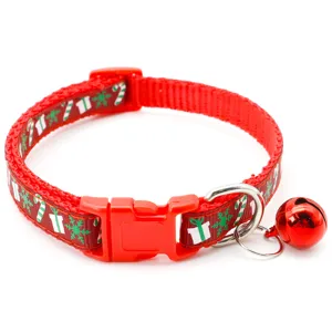 Christmas red pet cat dog collar detail close-up showing festive print pattern and metal bell.