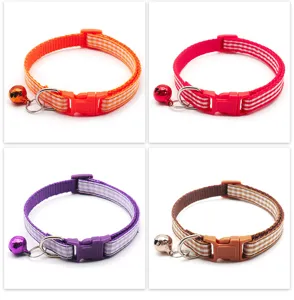 Detailed view of plaid fabric pet collar with bell and safety buckle for cats and dogs.