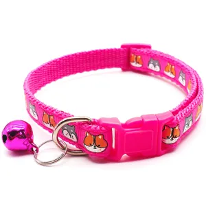 Pink pet collar detail showcasing cute cartoon animal prints, sturdy plastic buckle and bell.