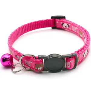 Pink pet cat dog collar with cute cartoon animal prints and bell, adjustable safety buckle.