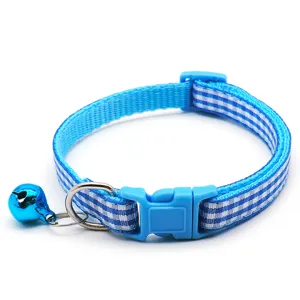 Blue plaid cat collar with bell, safety quick release buckle and metal D-ring detail.