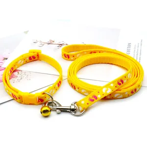 Cute cartoon pet collar and leash set detail, soft nylon material with bells for small dogs.