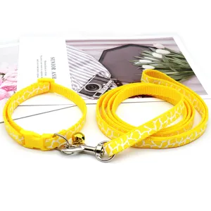 Yellow pet dog leash and collar set with cute white abstract print, adjustable for small dogs.
