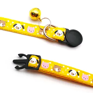 Cute cartoon print pet collar with golden bell and secure buckle for small dogs and cats.