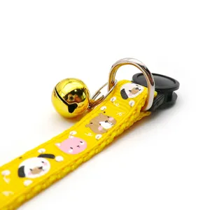 Cute yellow pet collar with cartoon animal prints, metal D-ring, and gold bell for cats dogs.