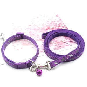 Purple pet collar and leash set with small dog pattern, adjustable nylon walking rope.