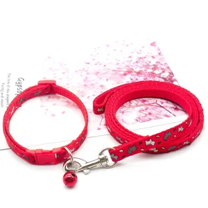 Red pet dog leash and adjustable collar set with small bell for small dogs and cats.