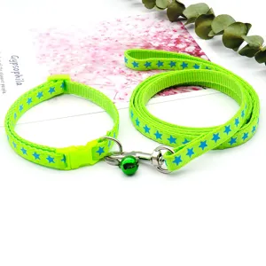 Green pet dog leash and collar set featuring a fun blue star print with a small metal bell.