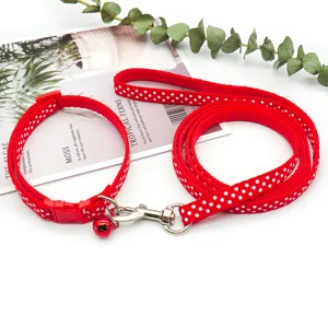 Red polka dot pet collar and leash set detail, durable fabric for small dogs and cats walking.