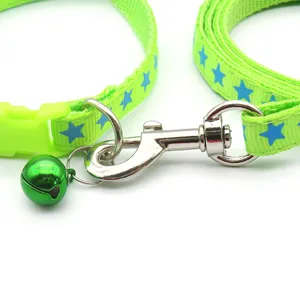 Green pet dog leash and collar set with blue star print, durable metal clasp and bell.