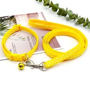 Yellow polka dot pet collar and leash set with bell, durable nylon puppy walking leash kit.