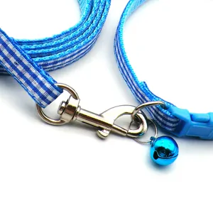Blue and white plaid pet dog cat leash and collar set detail view with metal bell hook.
