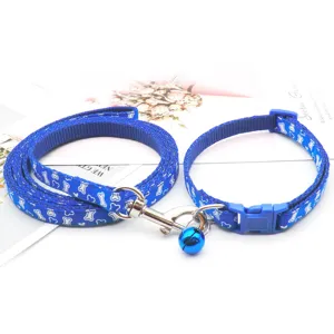 Blue pet collar and leash set detail showing the durable nylon fabric and cute bone pattern.
