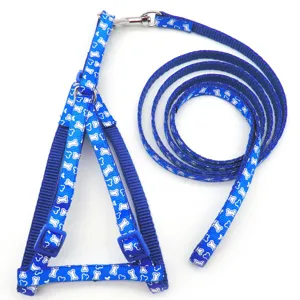 Blue nylon pet harness and leash set featuring white bone print for small dogs and cats.