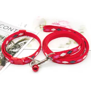 Red plaid pet leash and collar set with metal clasp and bell for small dogs and cats daily.