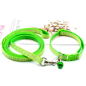 Green plaid pet leash and collar set with bell detail, ideal for walking cats and dogs.