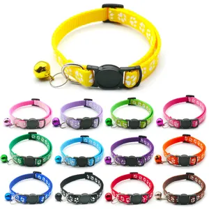 Adjustable nylon pet collar with paw print and bell for cats and dogs outdoor walking.