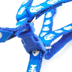 Blue pet chest harness detail view with white fish bone print and plastic buckle.