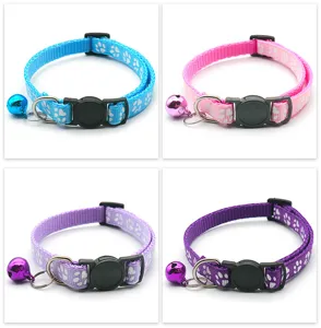 Close-up view of adjustable pet cat collar details featuring cute paw prints, safety buckle.