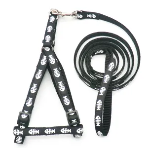 Black pet harness and leash set with white fish bone print for dogs and cats walking supplies.