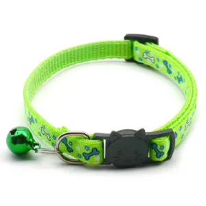Green pet collar with bell, cute bone print design, durable nylon material for daily use.