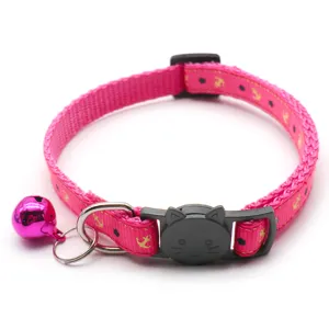 Pink pet collar with anchor print, cat head buckle and bell, perfect detail shot for cats and dogs.