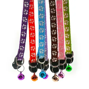 Colorful pet collar with cute paw print patterns and hanging bell, adjustable design for cats and dogs.