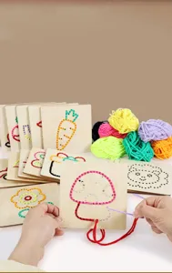 Kids wooden sewing lacing cards detail view showing colorful yarn and mushroom pattern.