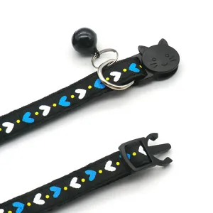 Black cat collar with cute blue and white hearts, safety buckle and a metal bell for lovely pets.