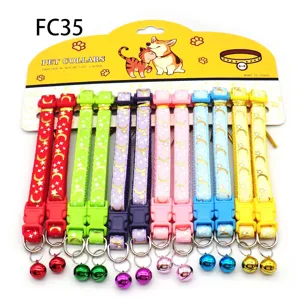 Colorful printed pet collars with bells, cat and dog fabric necklaces on card display.