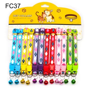 Colorful patterned pet cat dog collar with bell and quick release buckle on backing card.