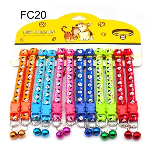 Colorful pet collar detail featuring cute animal patterns, durable fabric and small bell.