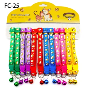 Detailed view of colorful pet collars with printed fabric patterns, bells, and buckles.