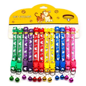Colorful pet collar set with cute cat prints and bells, carded packaging for cats and dogs.