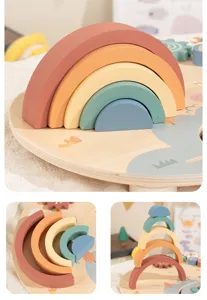 Wooden rainbow stacking toy detail view showing smooth multi-color arch blocks for toddlers.