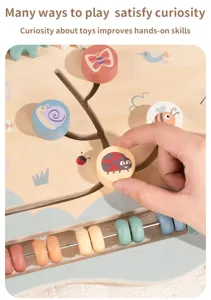Wooden busy board detail showing cute insect shapes and abacus beads for early childhood learning.