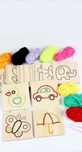 Children wooden lacing cards detail view, showing colorful yarn and various pattern boards.