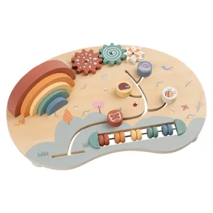 Wooden toddler busy board with rainbow stacker and gears for early learning and fine motor skills.