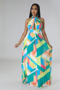 Close-up detail of the colorful geometric print halter pleated maxi dress fabric and design.
