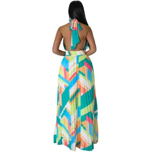 Detailed view of women's colorful geometric halter backless pleated maxi dress for resort wear.
