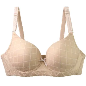 Plus size underwire push up bra for women, comfortable beige bra with grid texture.