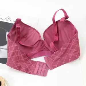 Detailed view of the rose red push-up bra with plaid texture and adjustable straps.