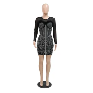 Close-up details of the sexy black mesh bodycon dress featuring sparkling rhinestones and feathers.